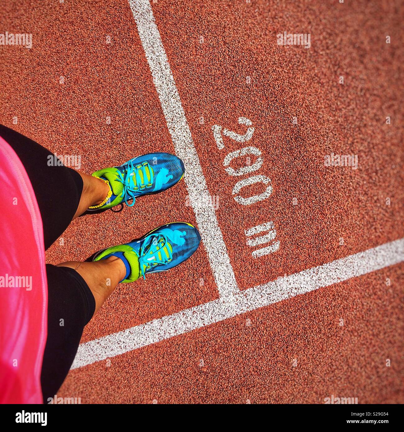 Female runner in front of 200 meters race - Smartphone Captured Stock Image