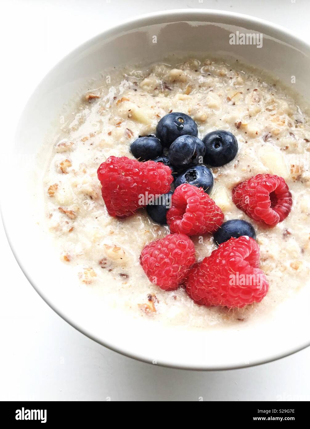 Close-up of a bowl of oat with blueberries and raspberries- Food photography - Smartphone Captured Stock Image