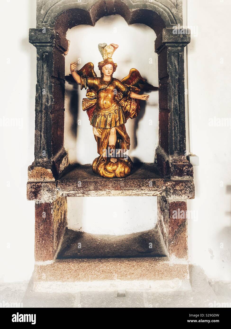 Santa Clara Convent, built for Franciscan Sisters in the 16th Century and still in use today, Funchal, Madeira, Portugal, Detail of a painted wooden angel in an alcove. - Smartphone Captured Stock Image