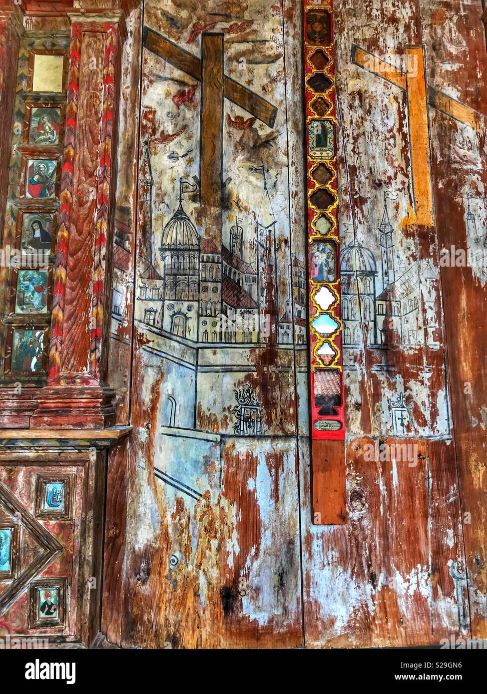 Santa Clara Convent, built for Franciscan Sisters in the 16th Century and still in use today, Funchal, Madeira, Portugal. Religious icons, painted on wood in the cloisters, a place of worship - Smartphone Captured Stock Image