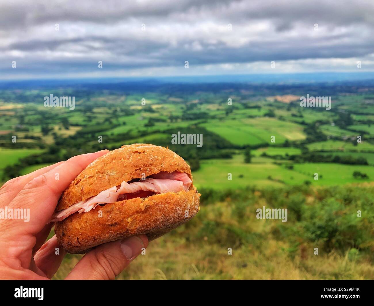 Lunch being taken with a view from the top of Skirrid Fawr, Eastern Brecon Beacons, near Abergavenny, Wales. - Smartphone Captured Stock Image