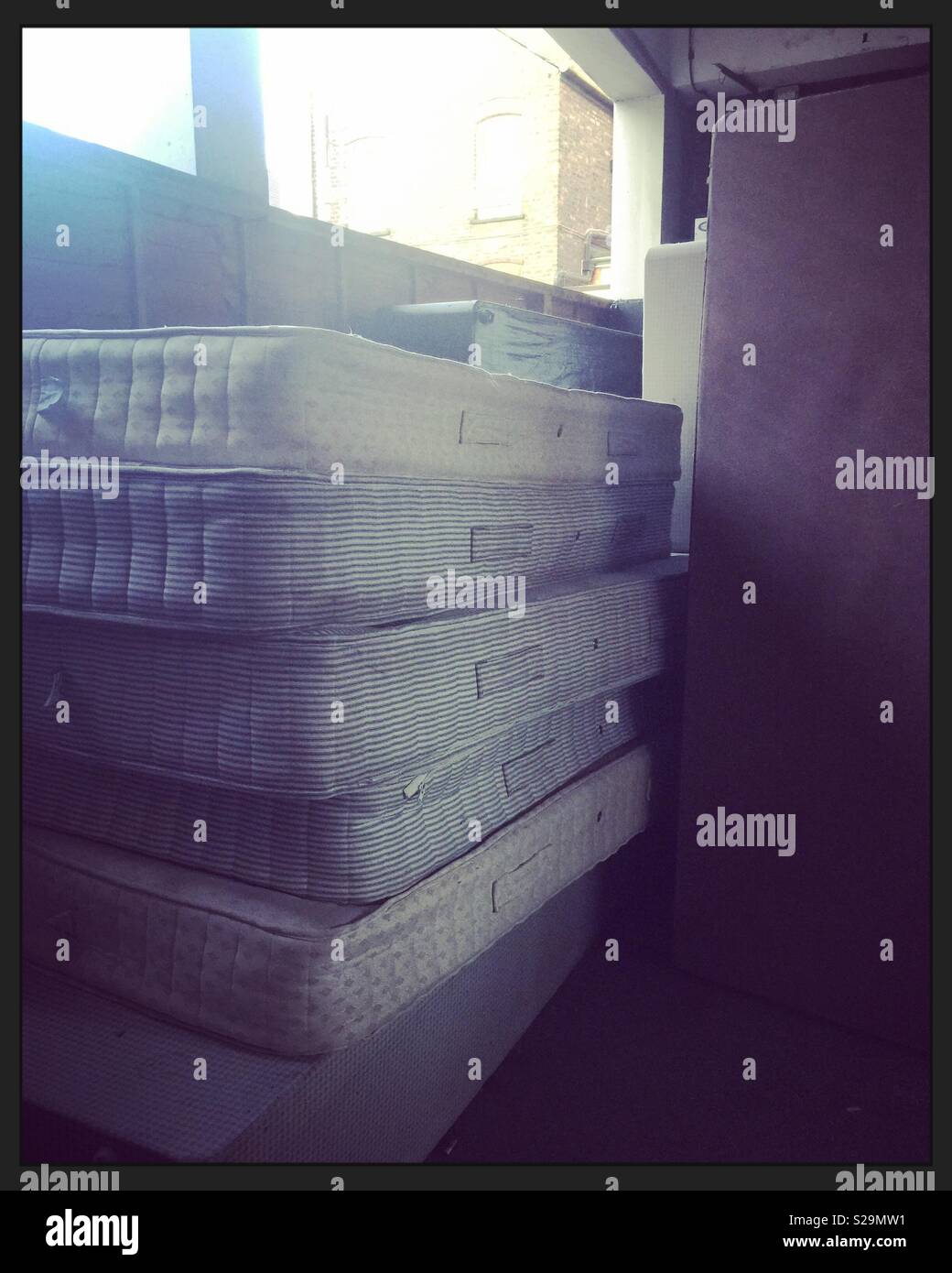 Stacked mattresses at a hotel Stock Photo Alamy