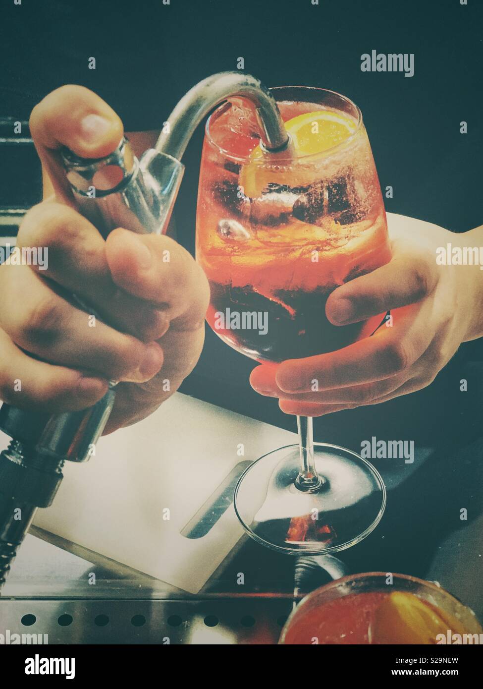 Woman bartender preparing a cocktail - Smartphone Captured Stock Image