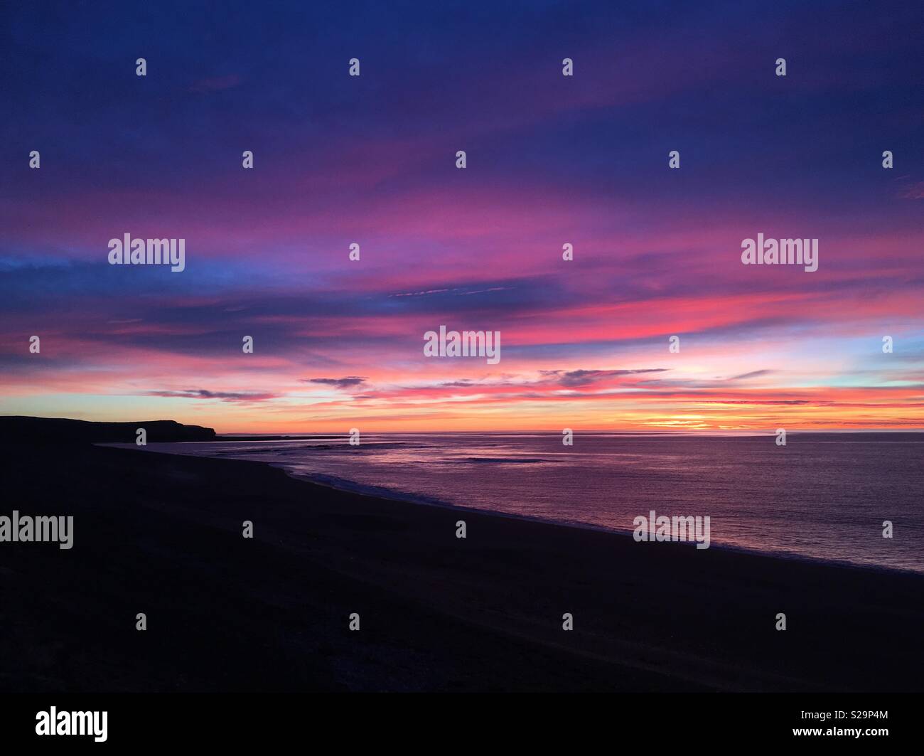 Magical sunrise at the Atlantic Ocean in Chubut, Argentina Stock Photo