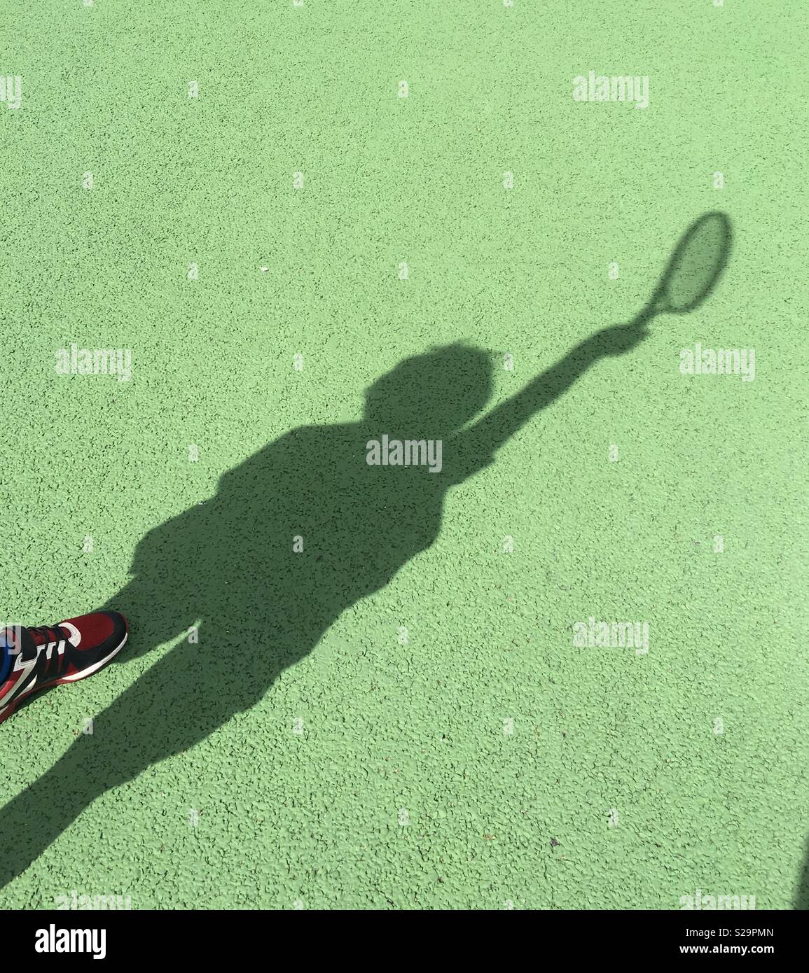 Tennis player shadow Stock Photo