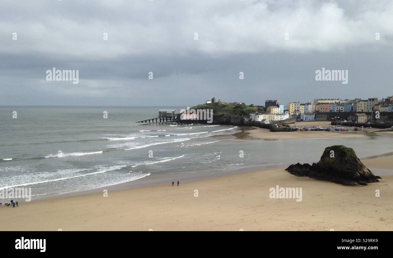 A view of Tenby North Beach and harbour showing the old and new lifeboat stations, Castle Hill, and part of the town and Goscar Rock - Smartphone Captured Stock Image