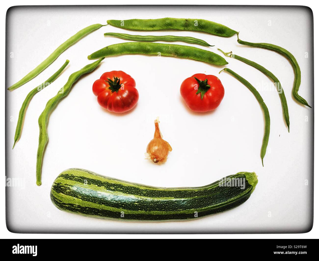 Organically home grown vegetables in the shape of a face - Smartphone Captured Stock Image