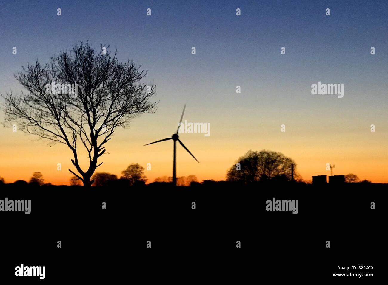 Renewable energy at sunset - Smartphone Captured Stock Image