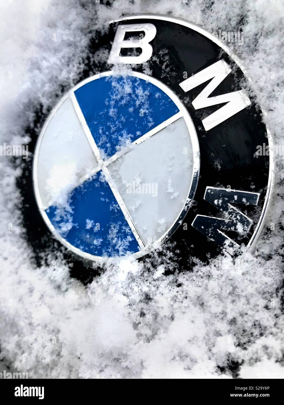 BMW badge in snow Stock Photo