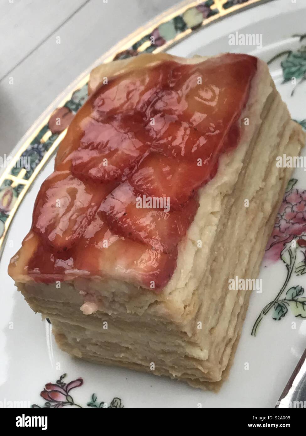 Strawberry layer cake on antique porcelain plate Stock Photo - Alamy