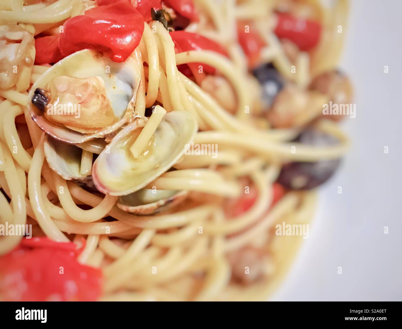 Spaghetti with tiny baby clams in the shell - Smartphone Captured Stock Image