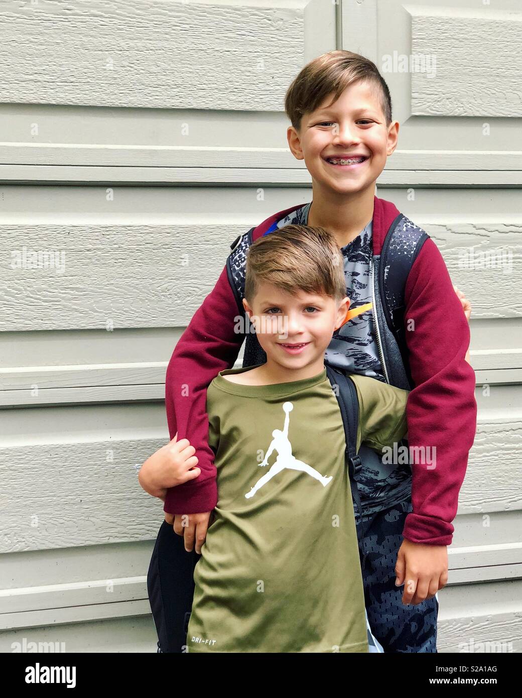 Happy brothers on first day of school Stock Photo