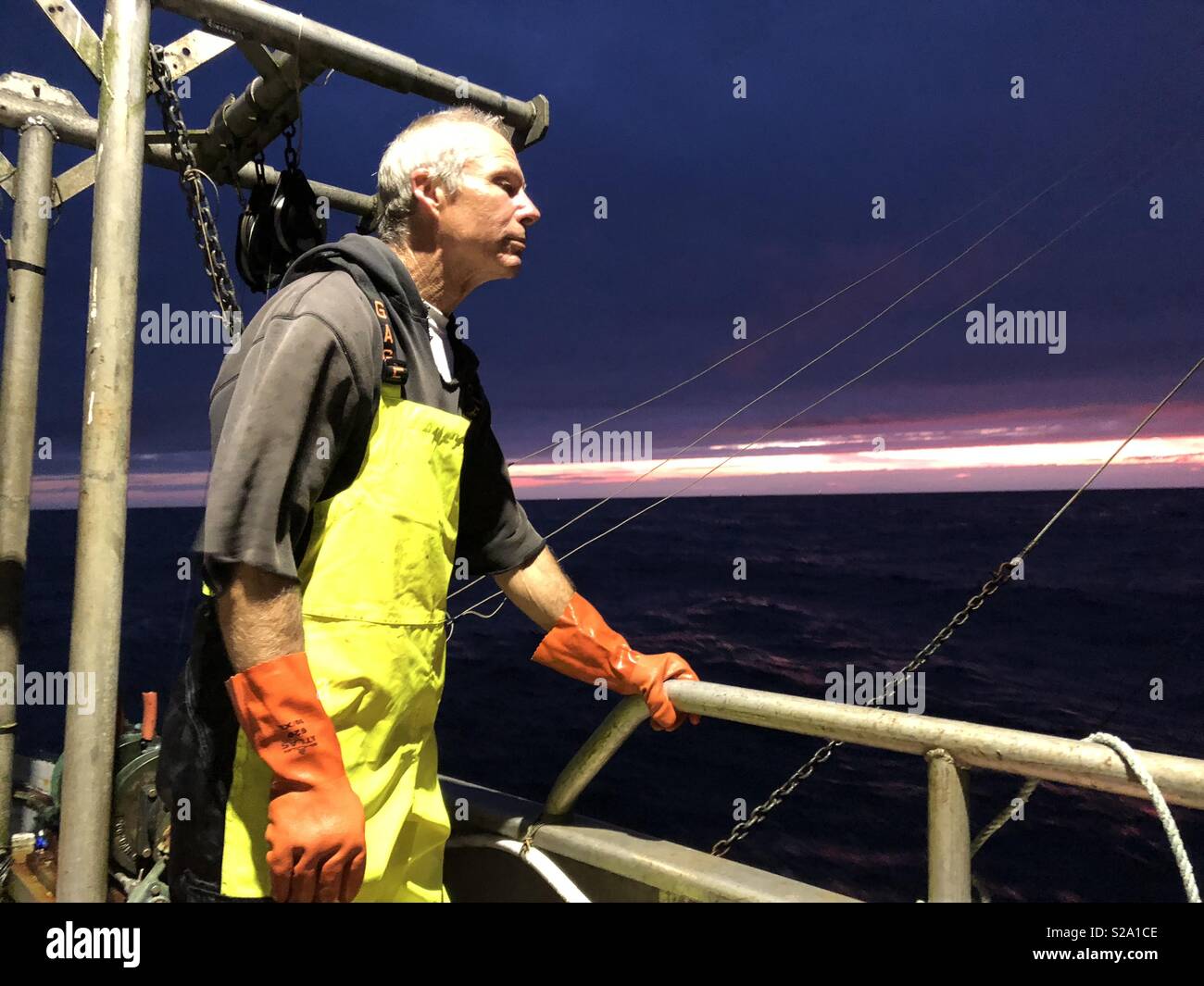 Sport fish charter boat troll fishing for salmon using downriggers and rods  with single action reels Stock Photo - Alamy