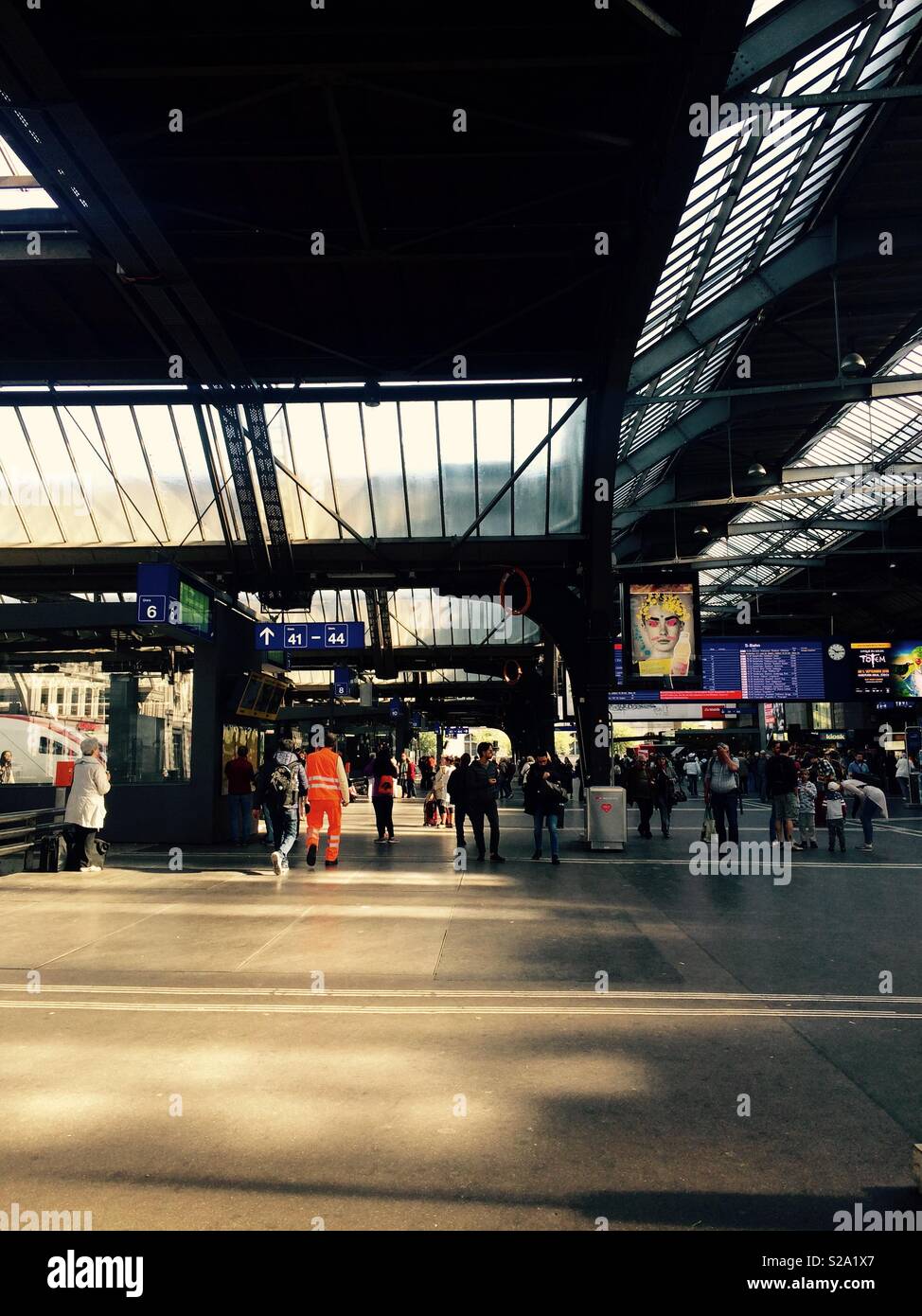 Zurich Hauptbahnhof or main train station in Switzerland during the busy daytime hours and rushing of commuters between trains Stock Photo