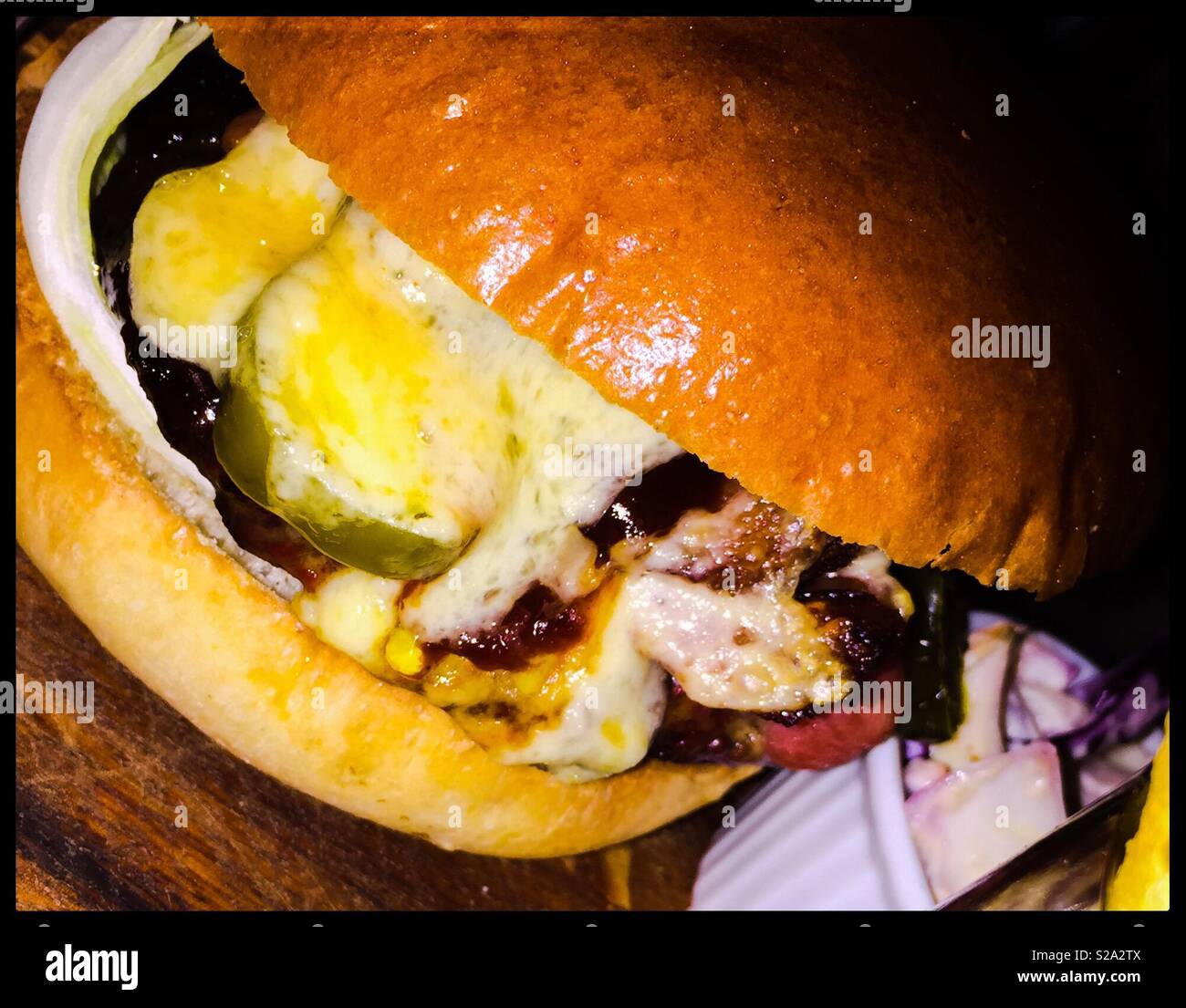 Cheesy burger in brioche bun Stock Photo