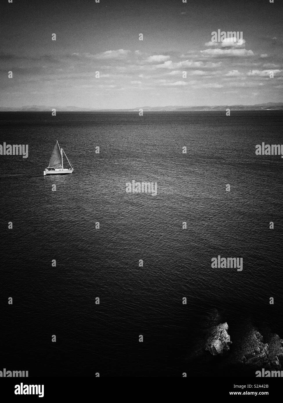 Sailing boat off the coast of West Wales. - Smartphone Captured Stock Image