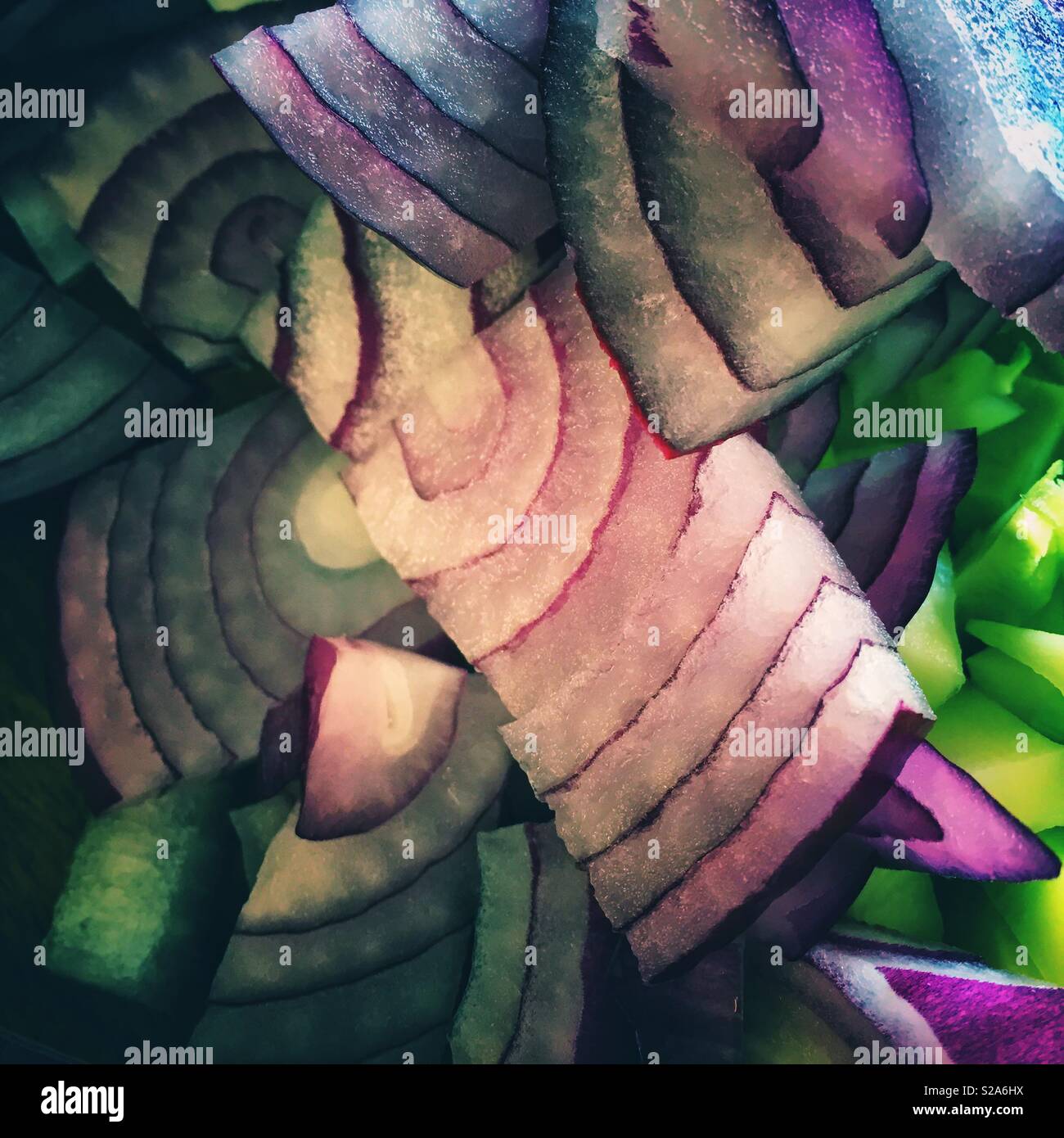 Red onion slices and chopped vegetables Stock Photo