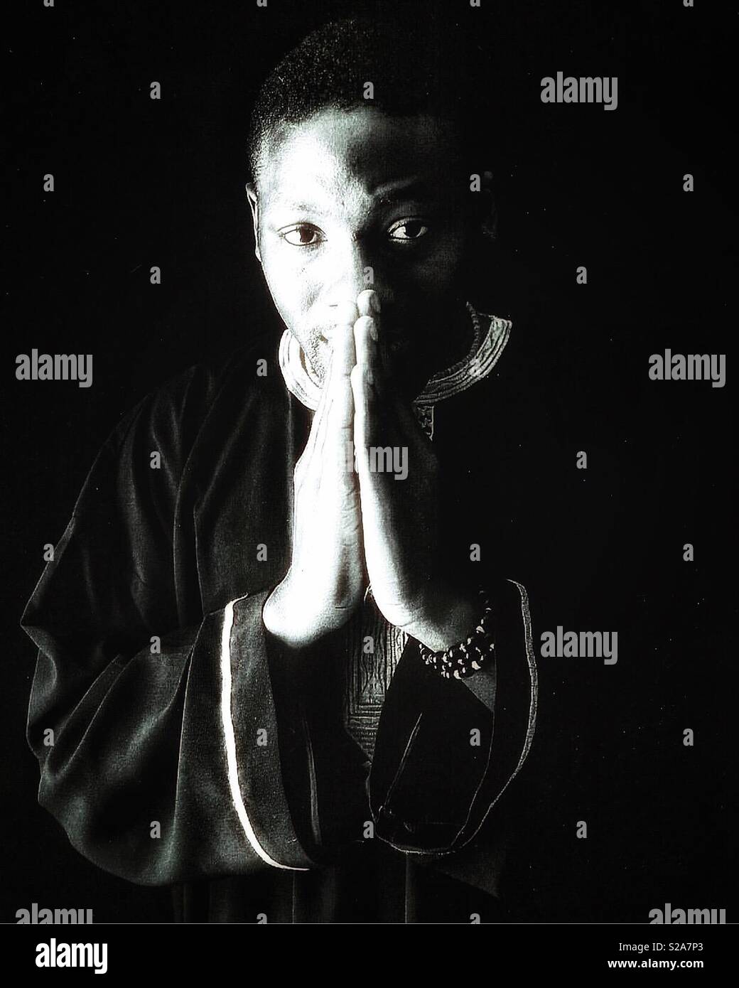 Portrait of a Black gentleman clasping his hands. Stock Photo