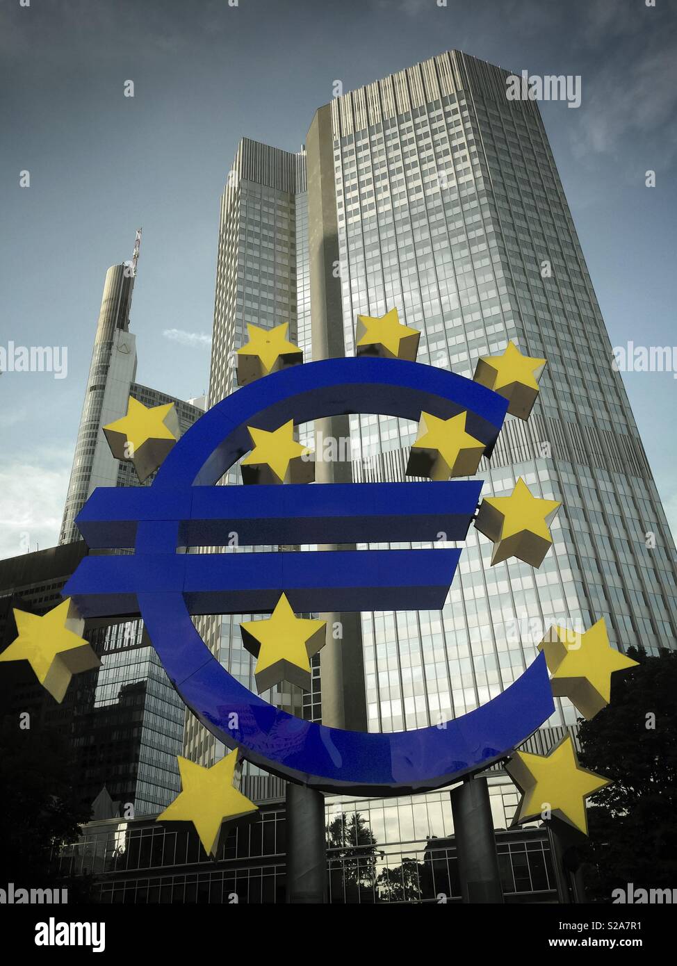 Euro sign statue in front of skyscrapers in Frankfurt am Main, Germany, Europe - Smartphone Captured Stock Image