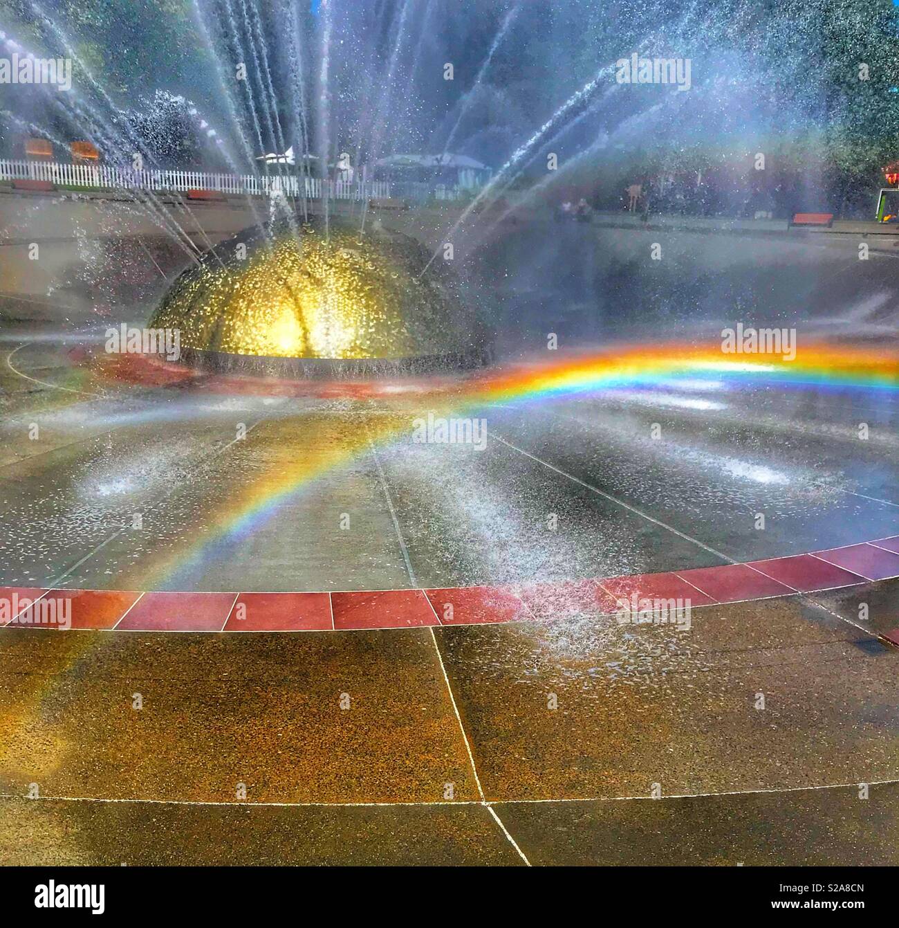 Rainbow in the water fountain in Seattle - Smartphone Captured Stock Image