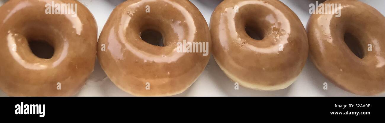 Beautiful golden glazed donuts Stock Photo