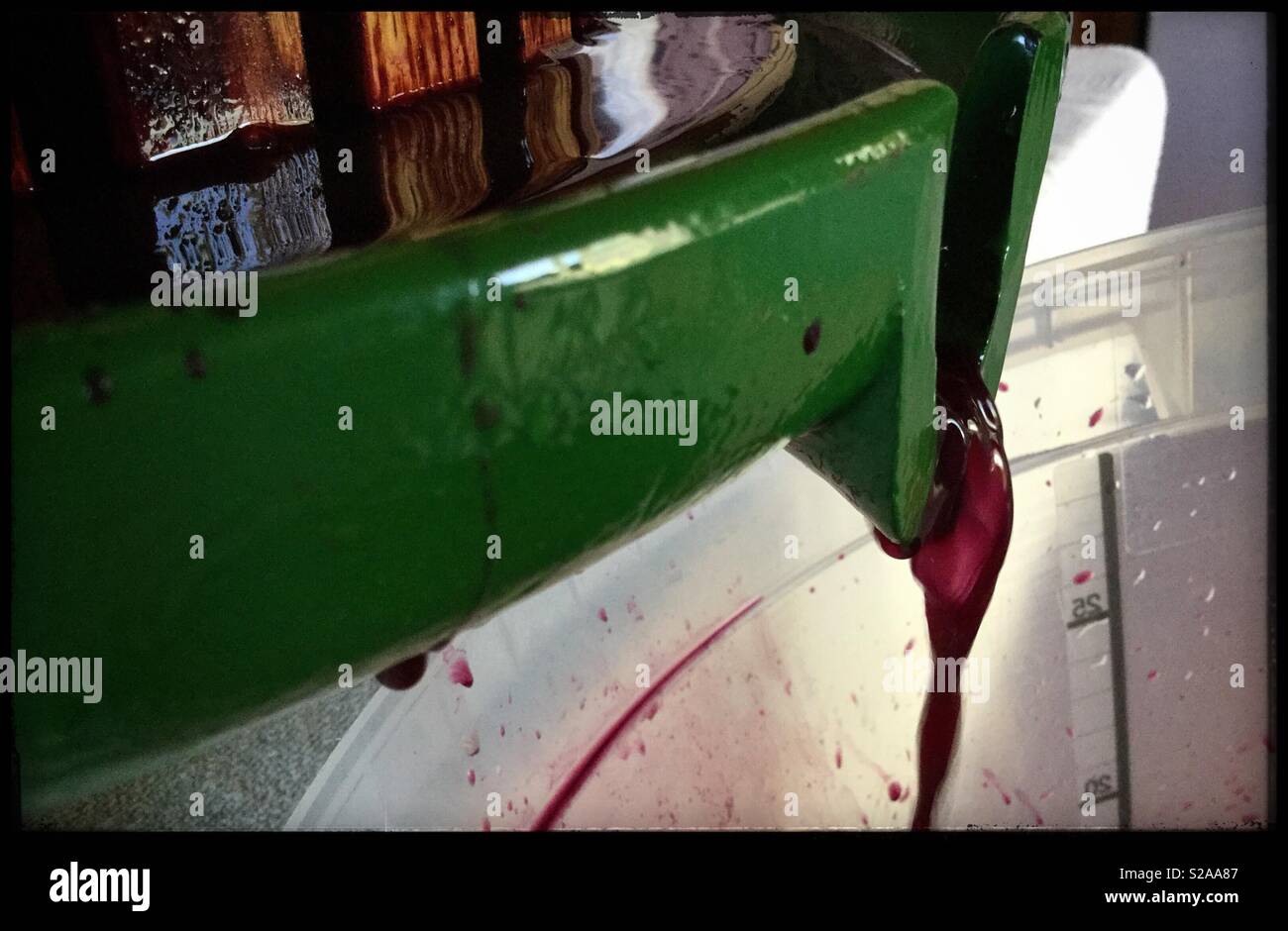 Pressing Syrah wine post fermentation, Catalonia, Spain. - Smartphone Captured Stock Image
