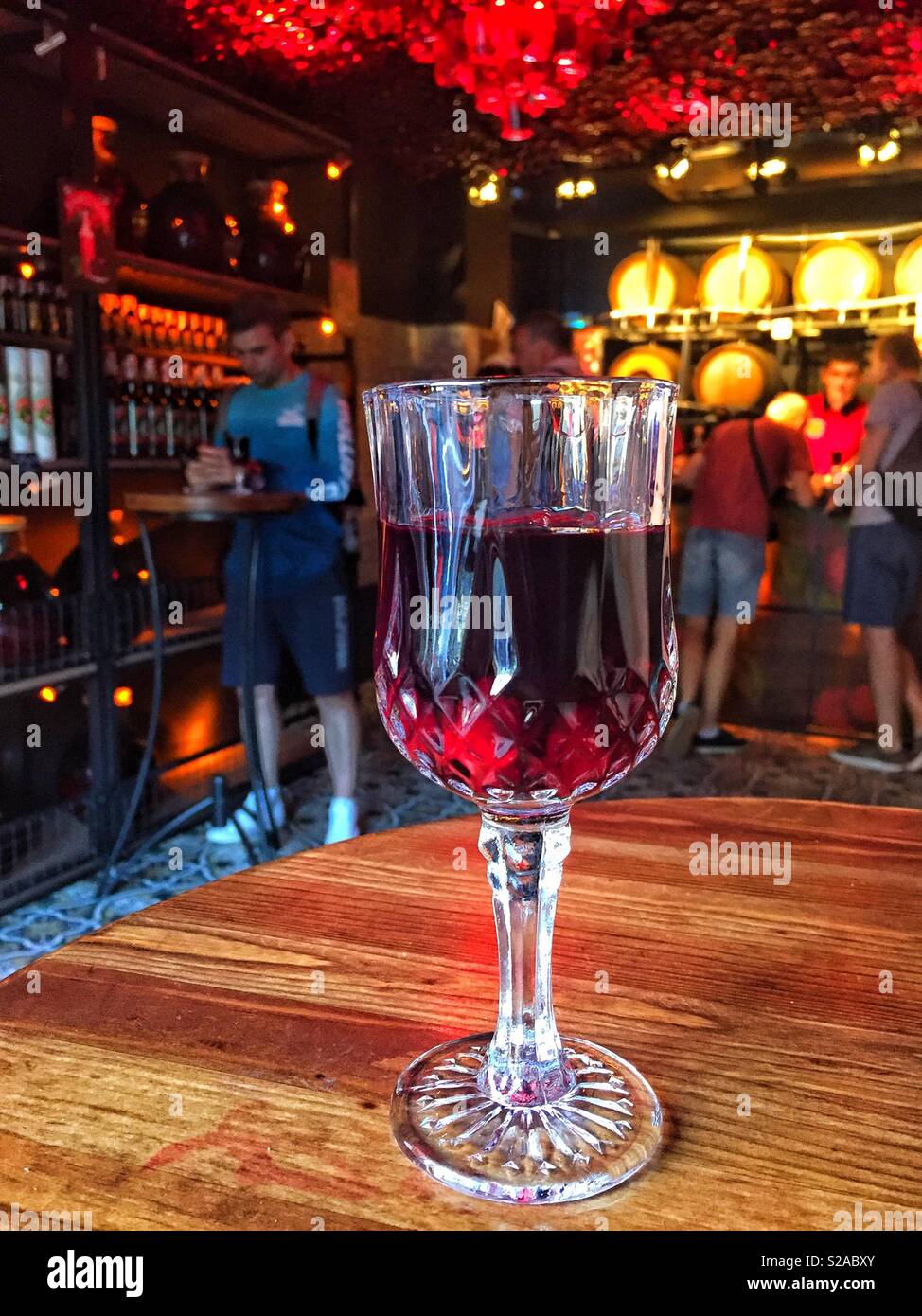 Cherry liquor in the glass close up in the table in the bar - Smartphone Captured Stock Image