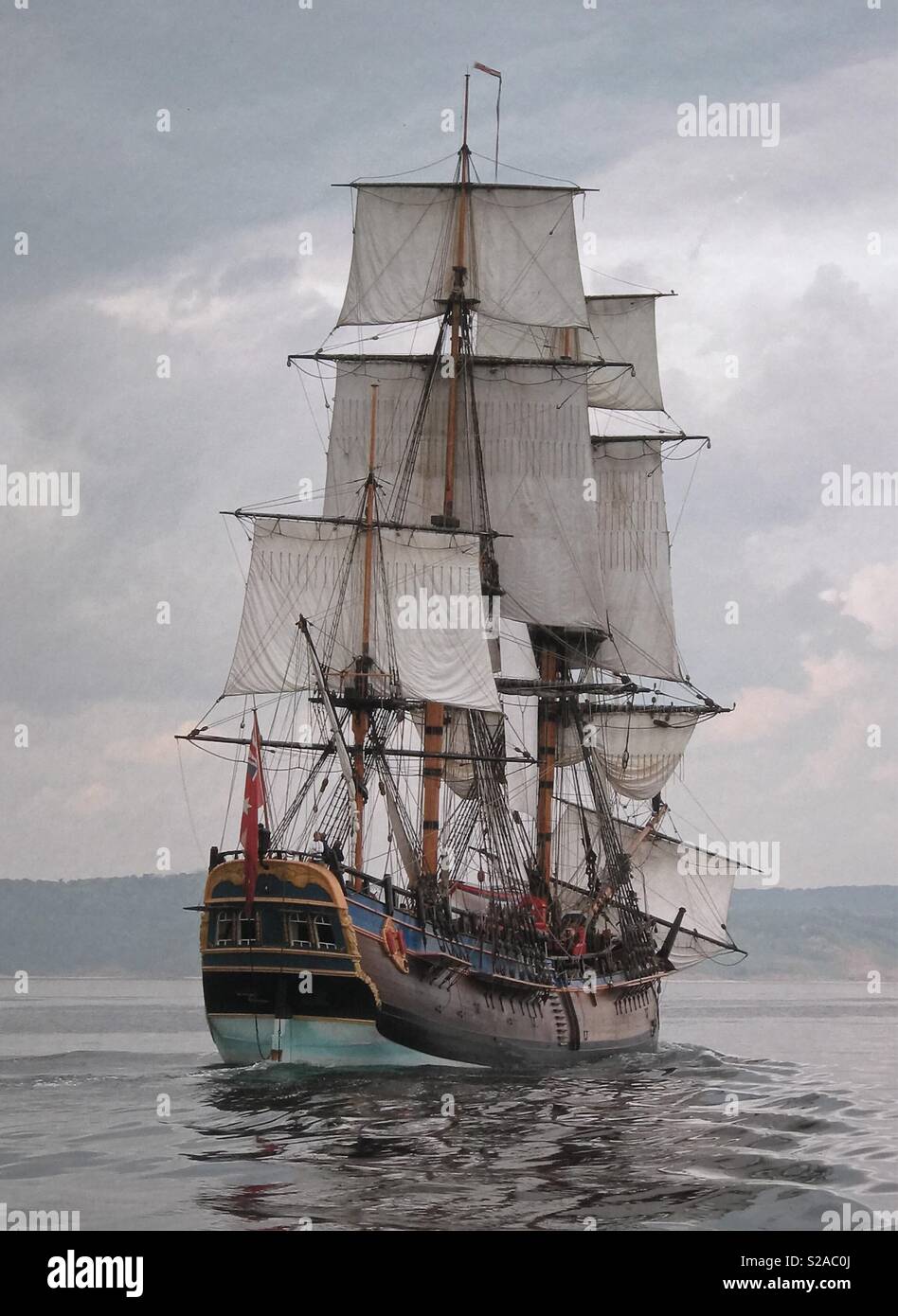 Replica of Captain Cooks ship HM Bark Endeavour sailing off the