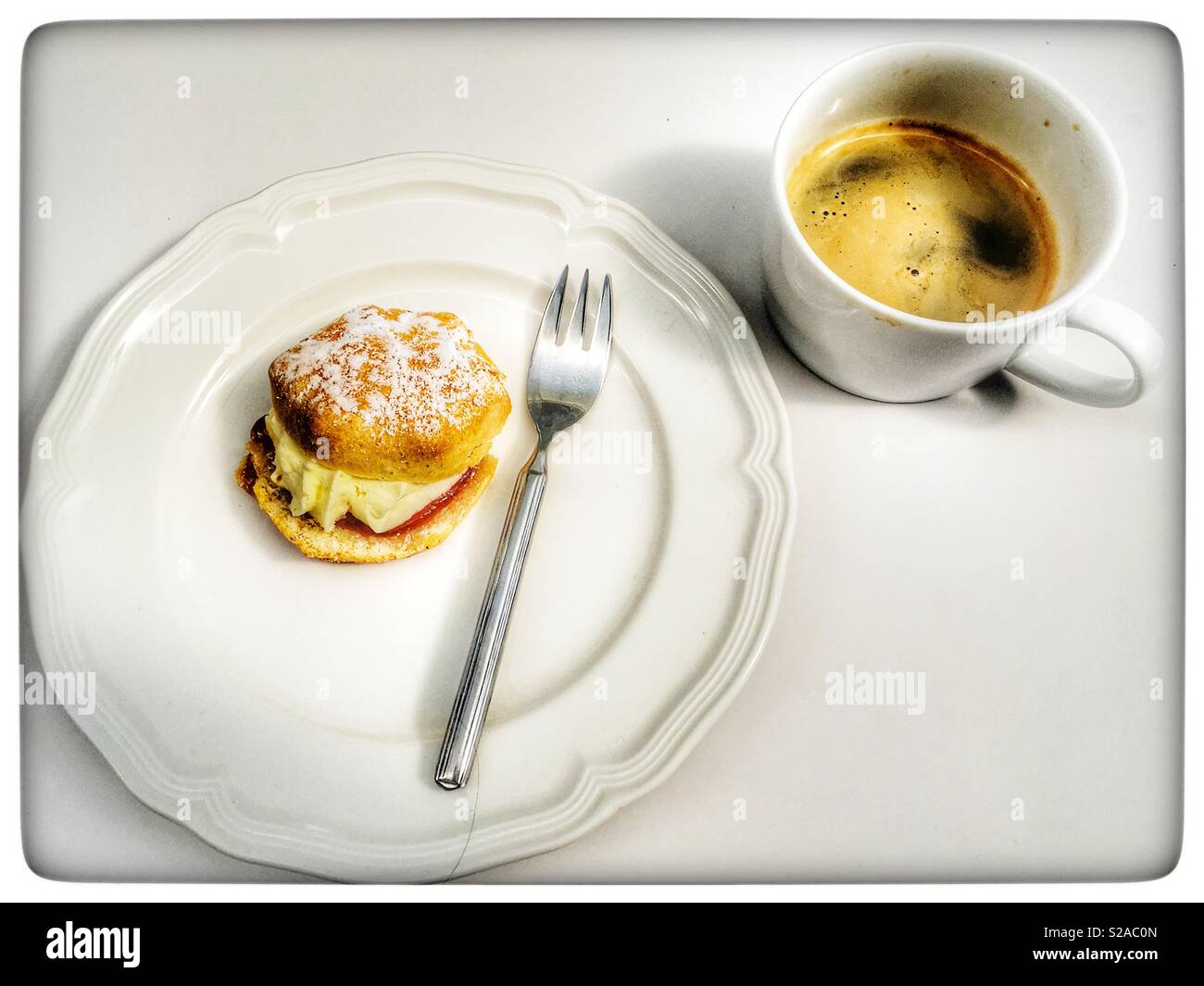 Strawberry jam and cream scone with black coffee - Smartphone Captured Stock Image