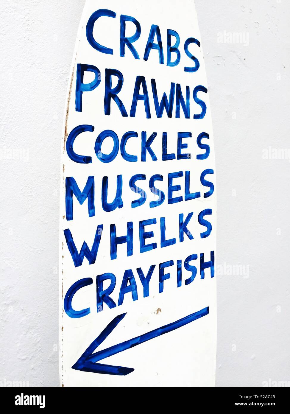 Sign for shellfish and seafood outside a fresh fish shop in Norfolk, England. Stock Photo