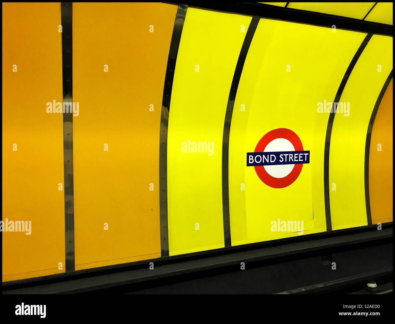 Colourful Signage on the London Underground (Tube) System indicating this station is “BOND STREET.” This station is on the Central & Jubilee Lines. Photo Credit - © COLIN HOSKINS. Stock Photo