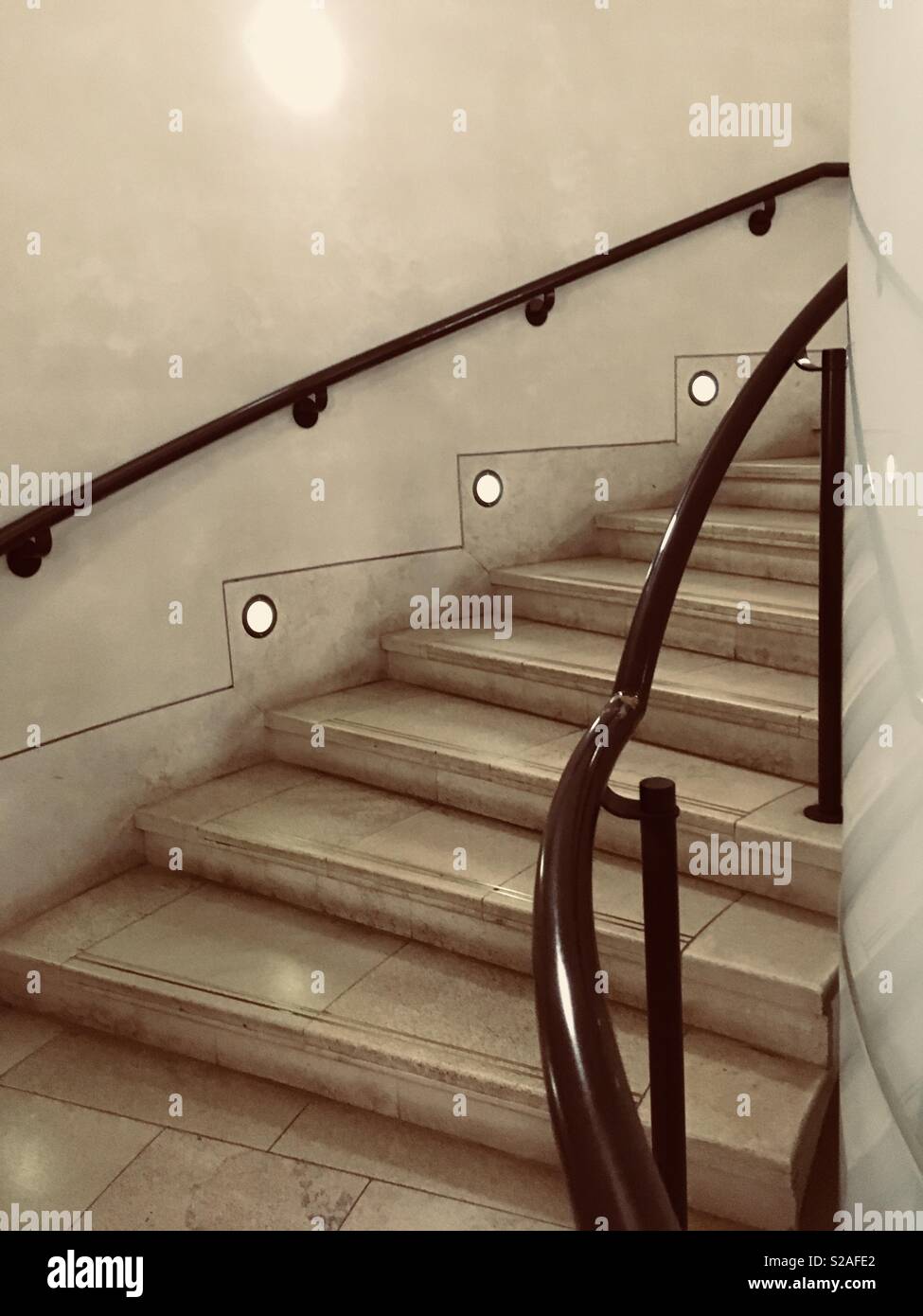 Curved staircase leading up Stock Photo
