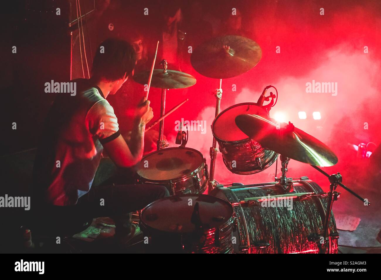 Drummer in a punk band performing onstage at a concert Stock Photo Alamy