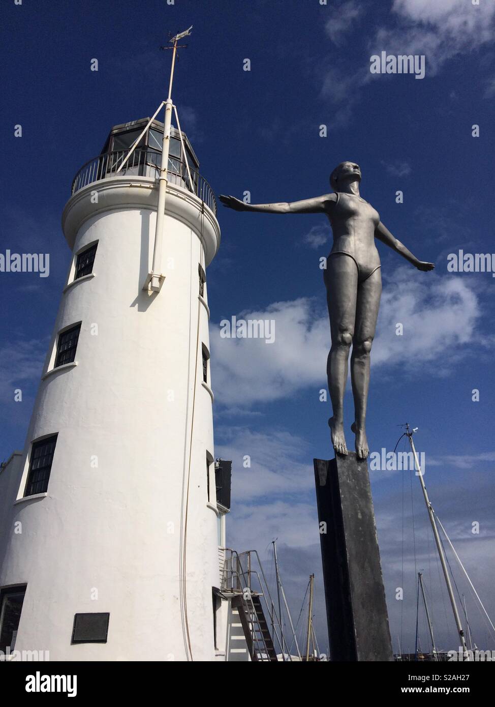 Scarborough Diving Belle statue and lighthouse Stock Photo Alamy