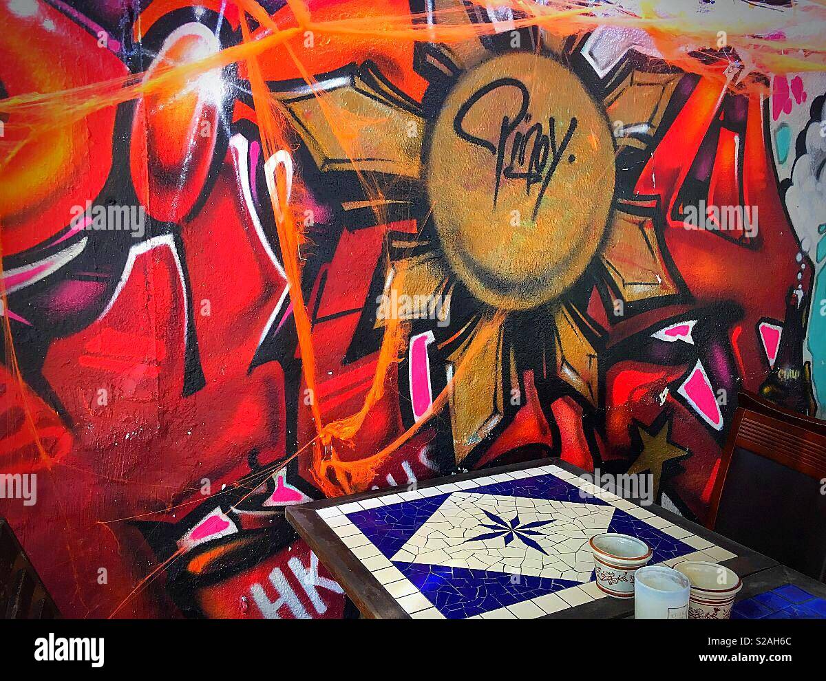 Graffiti art on the wall of a local bar in Stanley, Hong Kong Stock Photo -  Alamy