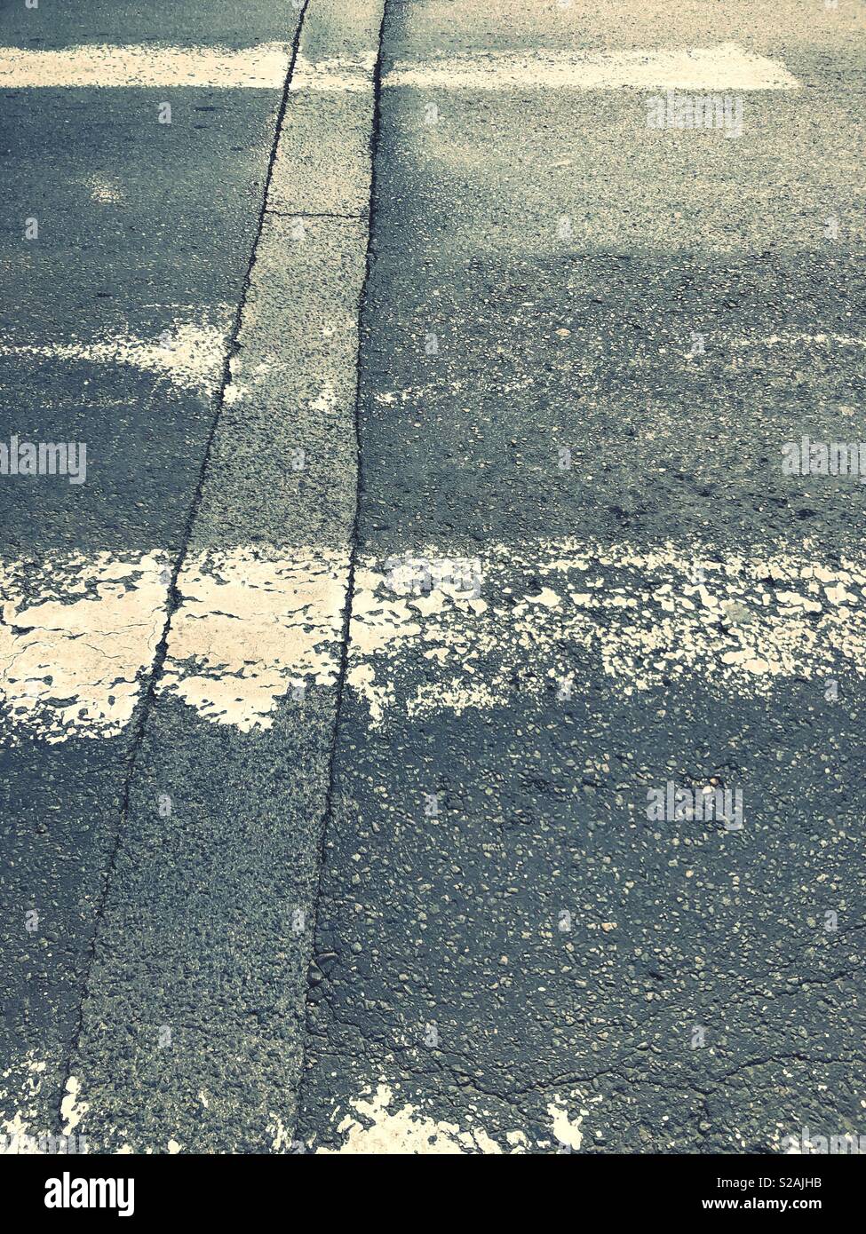 Old weathered zebra crossing Stock Photo