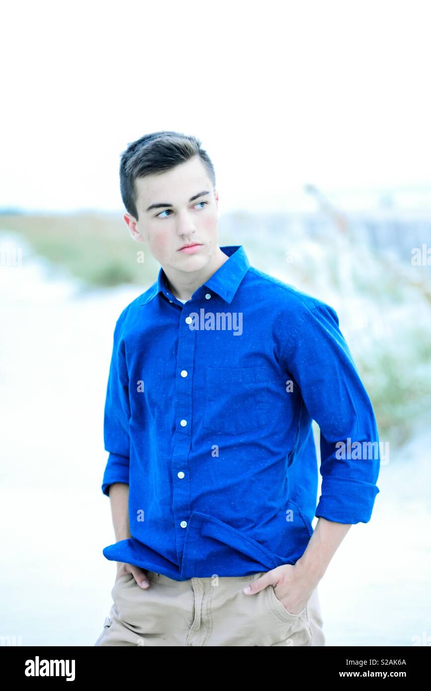 Handsome young man on beach looking away from camera. - Smartphone Captured Stock Image