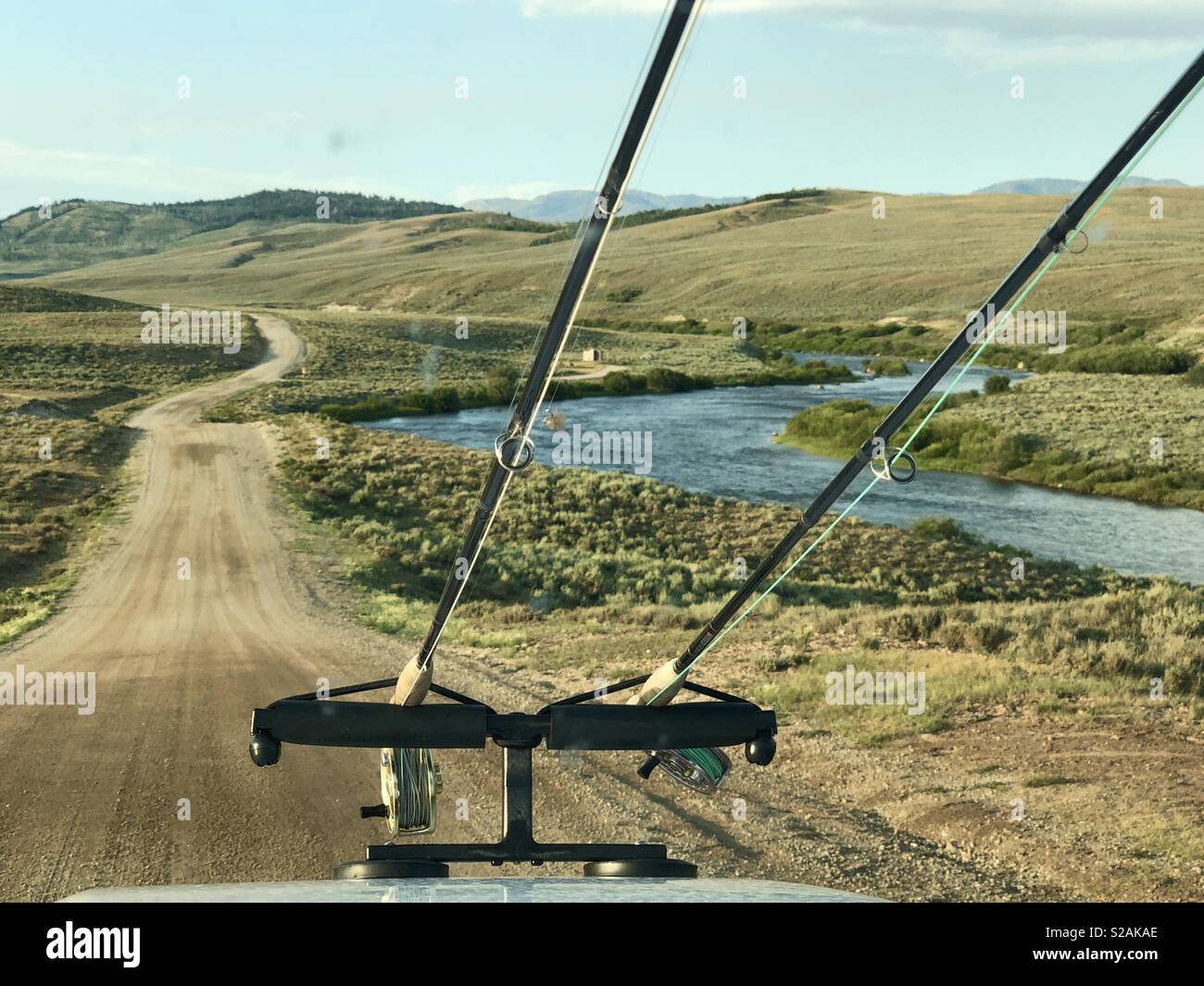 Fly Rods on a truck as it heads out to fish the evening hatch. Upper Green River near Pinedale, Wyoming. Stock Photo