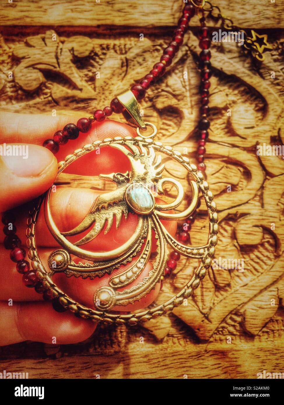 Phoenix pendant necklace jewelry Stock Photo - Alamy
