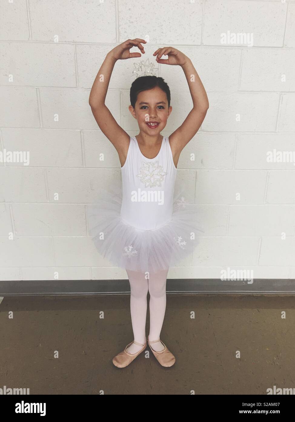 Female child posing in her ballet recital costume. Stock Photo