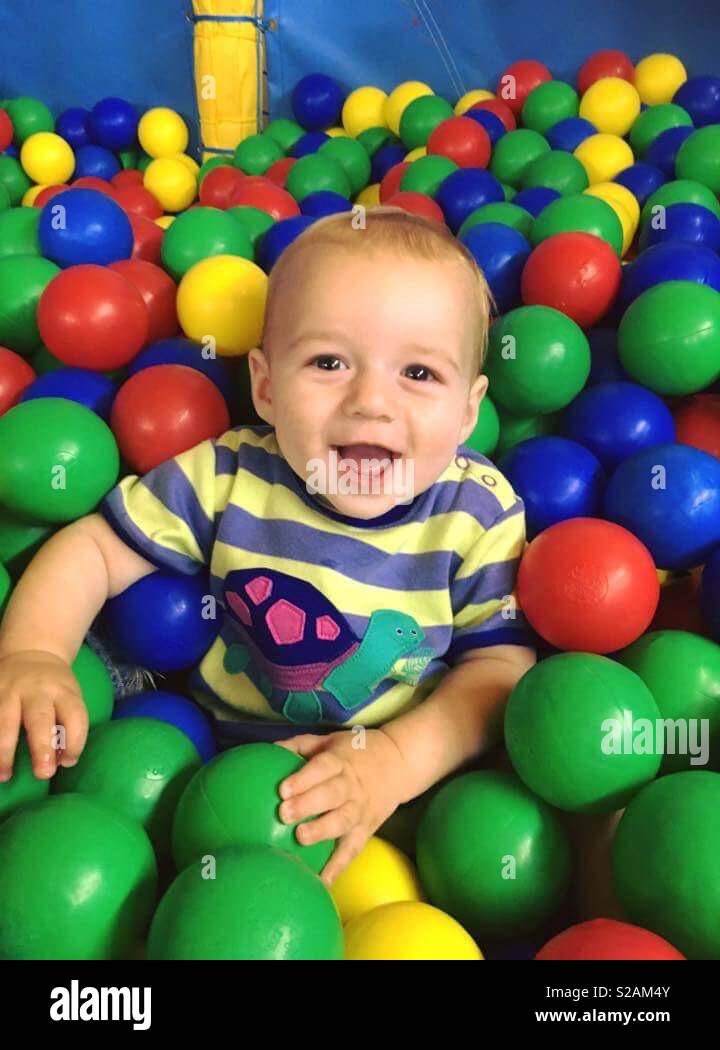 Baby In ball pit Stock Photo Alamy