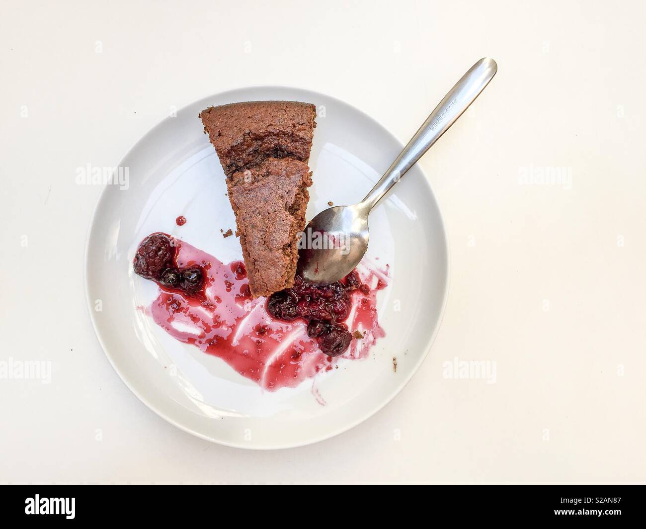a dish with jam and chocolate cake - Smartphone Captured Stock Image