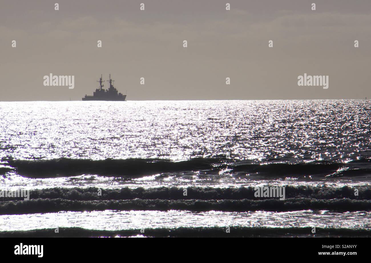 I.S. Navy guided missile cruiser on the horizon off the coast of Southern California. - Smartphone Captured Stock Image