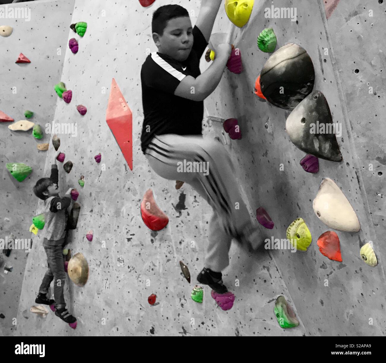 2 children climbing on an indoor rock climbing centre Stock Photo Alamy