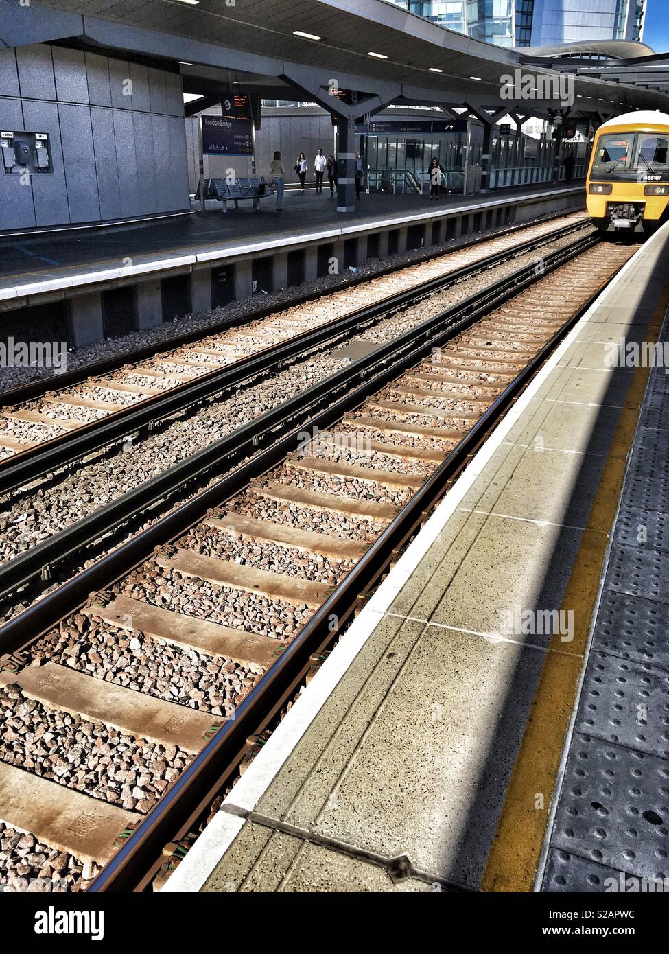 A train approaching a platform at London Bridge station in England - Smartphone Captured Stock Image