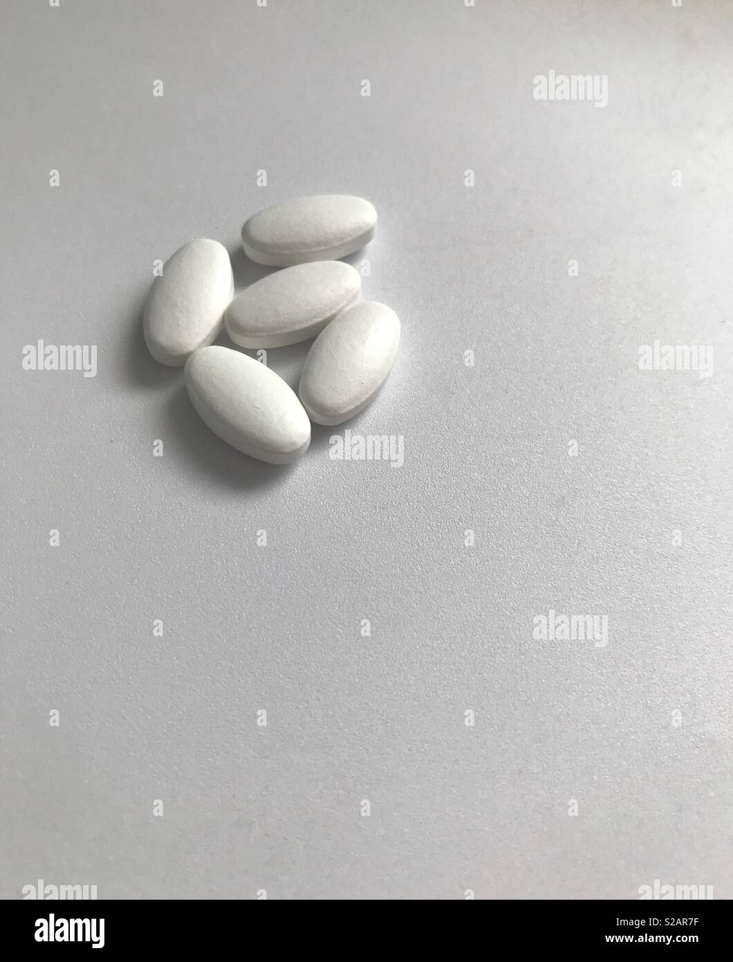 Five pills Stock Photo - Alamy