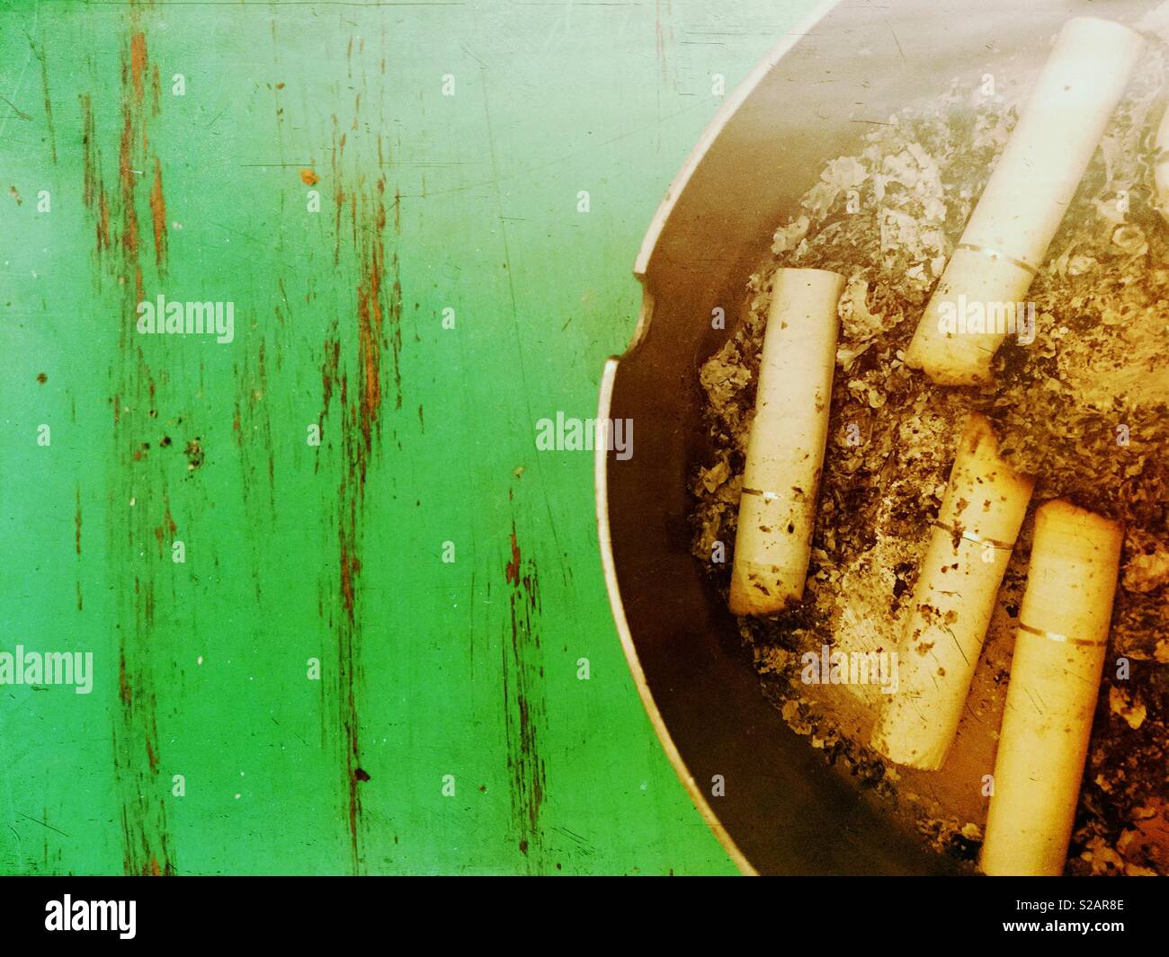 Cigarette butts in ashtray - Smartphone Captured Stock Image