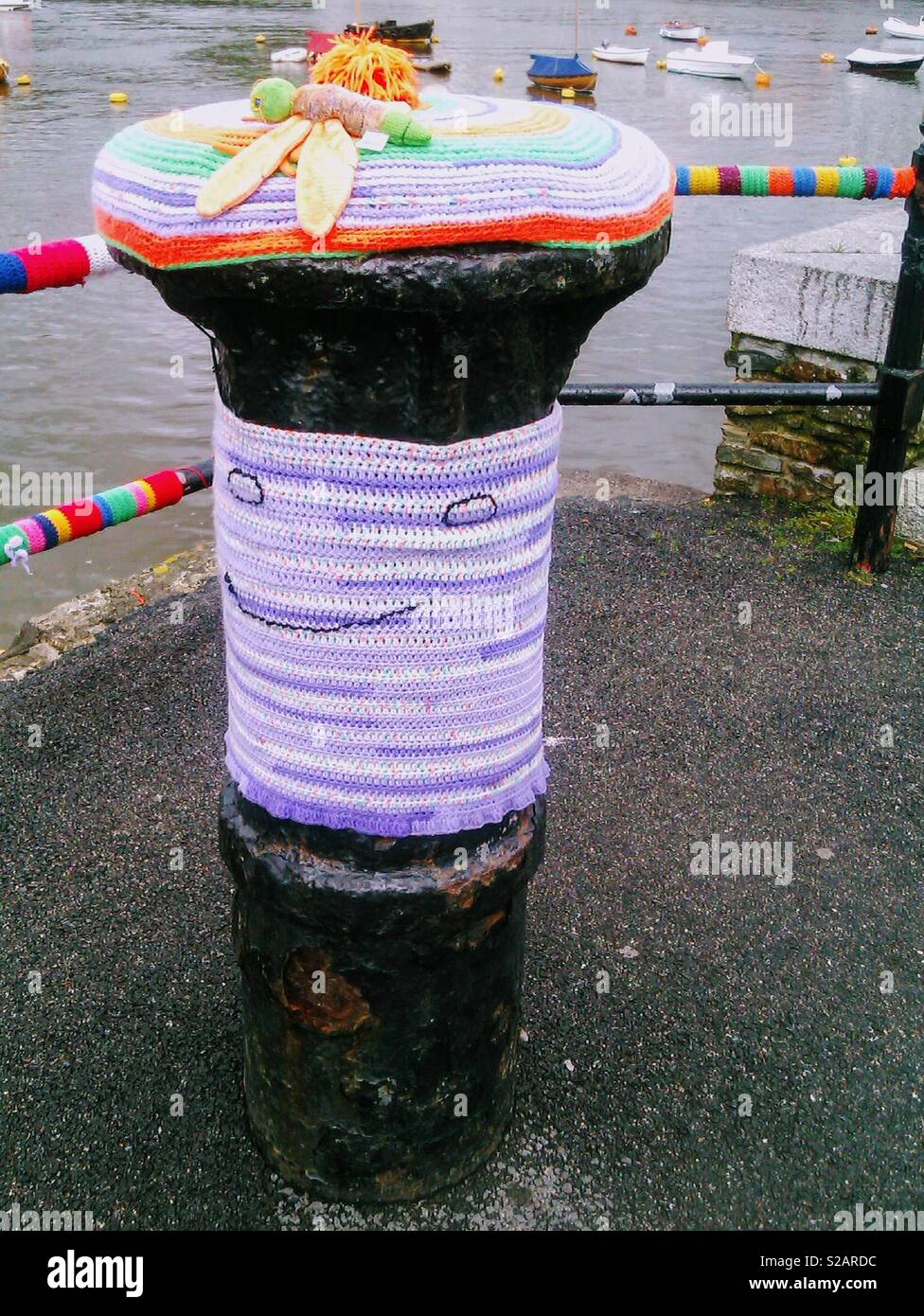 Yarn bombing of a bollard in Fowey Cornwall Stock Photo Alamy