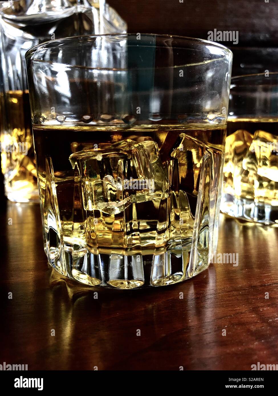 Glass of whiskey on a dark wood background - Smartphone Captured Stock Image