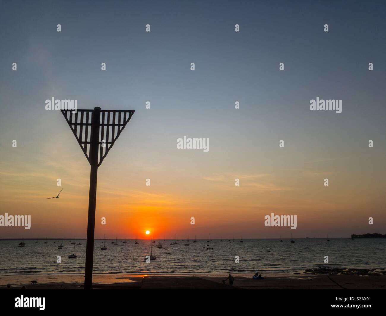 Sunset over the Sailing Club beach in Darwin, Northern Territory, Australia. - Smartphone Captured Stock Image